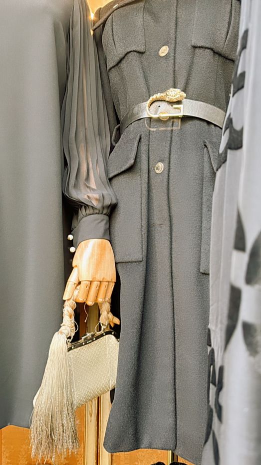The window: coat with a jewelled belt