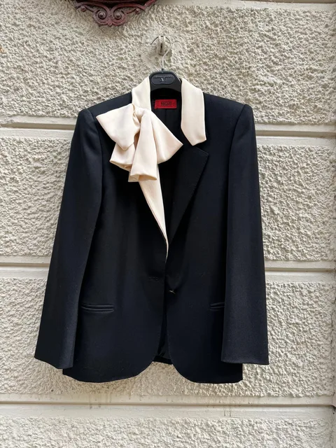 Valentino Garavani — Black jacket with white silk lapels and bow
